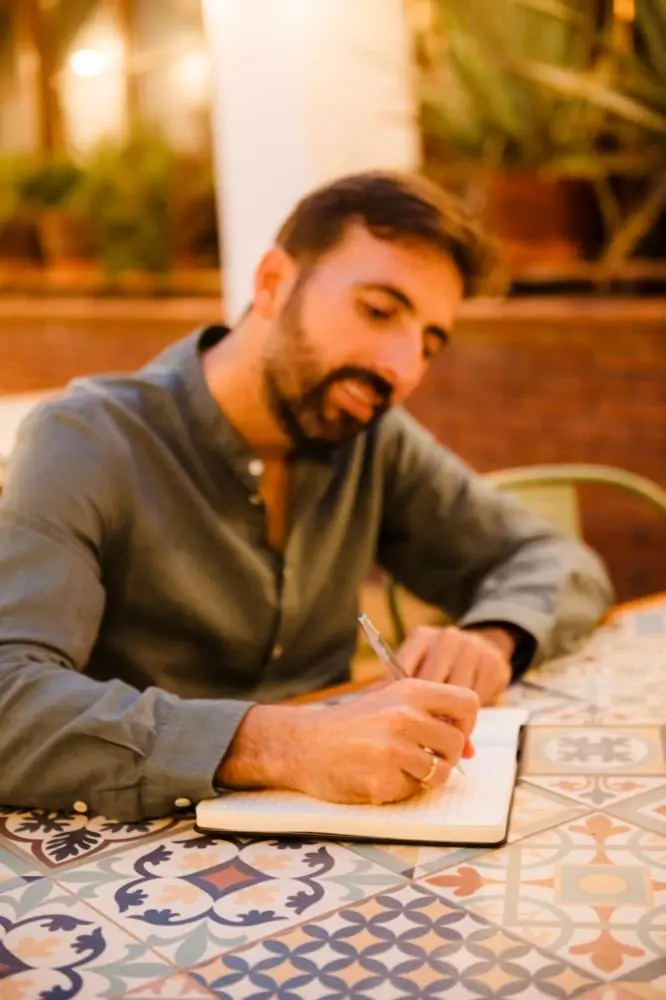 Taking notes in a notebook during a working day